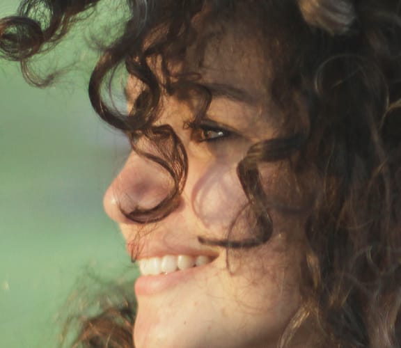 Young woman looking over her right shoulder